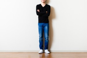 Man,Standing,In,Front,Of,The,Wall,Of,The,Room